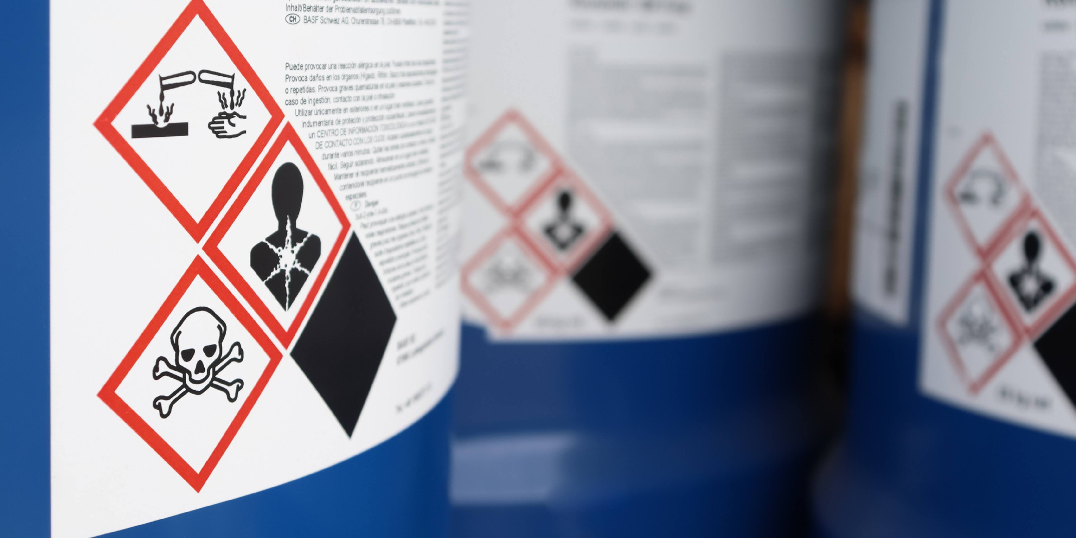 WHMIS label with pictograms on a blue chemical tank