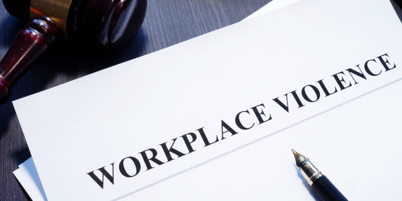 Document about Workplace Violence on a desk, a pen on top of the document