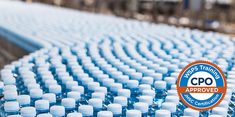 Image of water bottles stacked on a conveyor belt in warehouse 