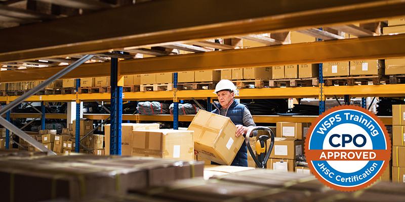 Image of a warehouse worker stacking a box on shelf