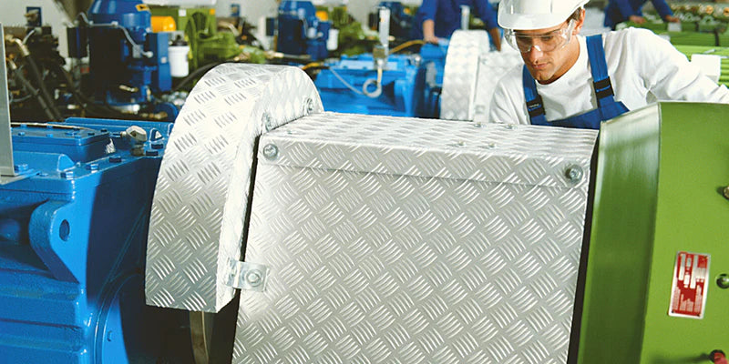 Image of a person working on a machine