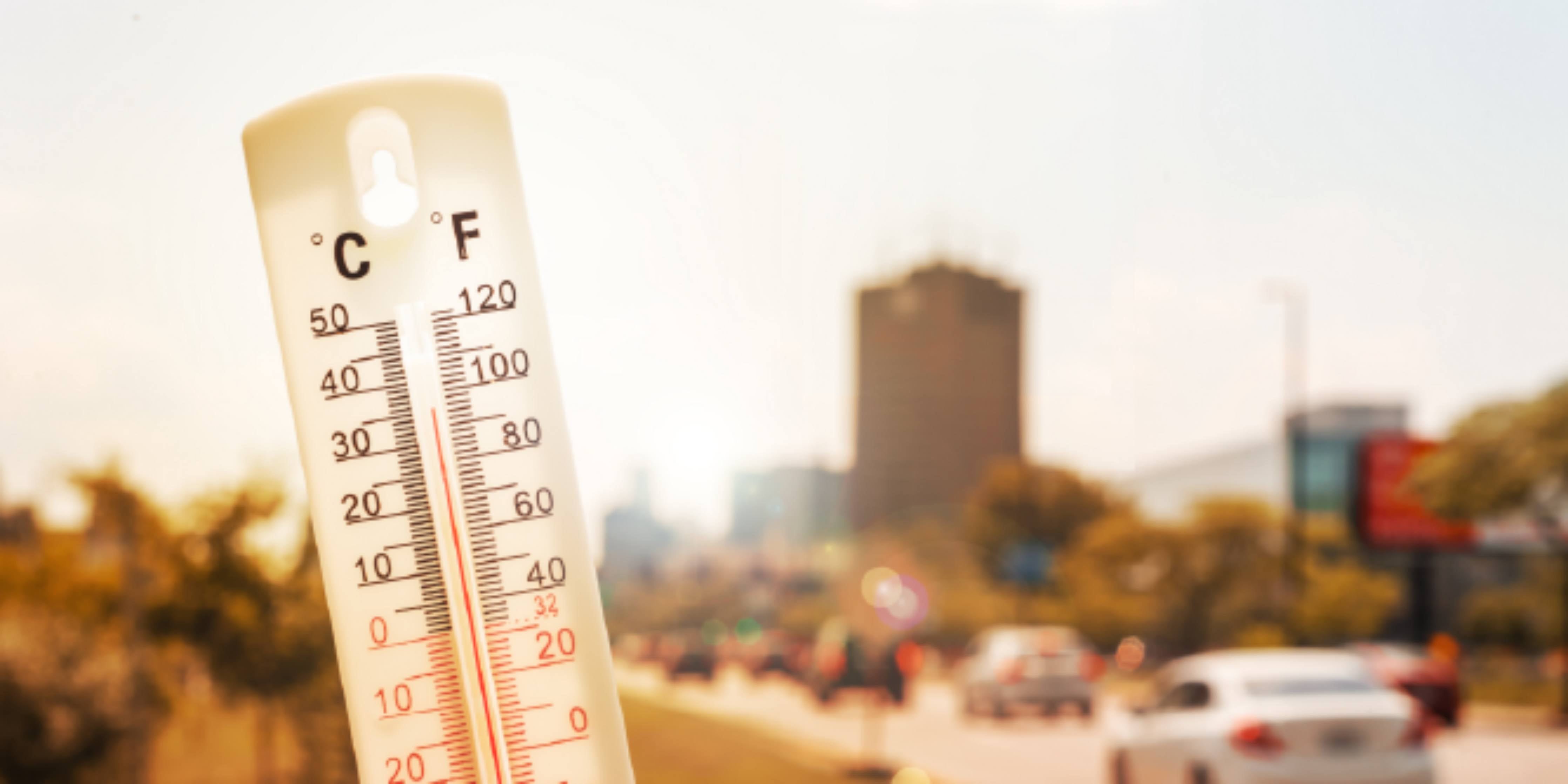 thermometer in front of city