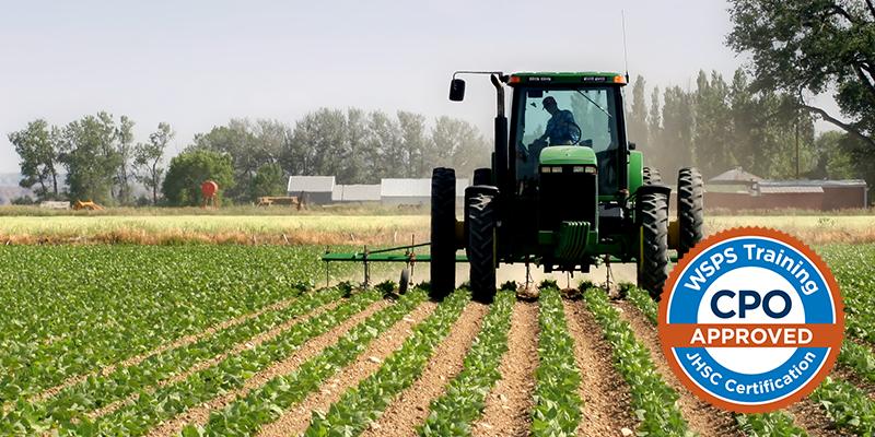 Tractor plowing field